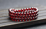 Natural Wine Red Garnet Three Ring Bracelet, with beads approximately 5.6 to 5.7mm in diameter2610169354