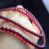 Natural Wine Red Garnet Three Ring Bracelet, with beads approximately 5.6 to 5.7mm in diameter2610169354