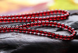 Natural Wine Red Garnet Three Ring Bracelet, with beads approximately 5.6 to 5.7mm in diameter2610169354