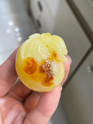 The natural raw mineral white flower cleverly carved and colorful honey wax money bag pendant is approximately 36.6x31.9x29.4mm in size0811790133